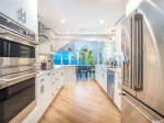 The fully-equipped kitchen is a bright, expansive space for all your gourmet cooking needs.
